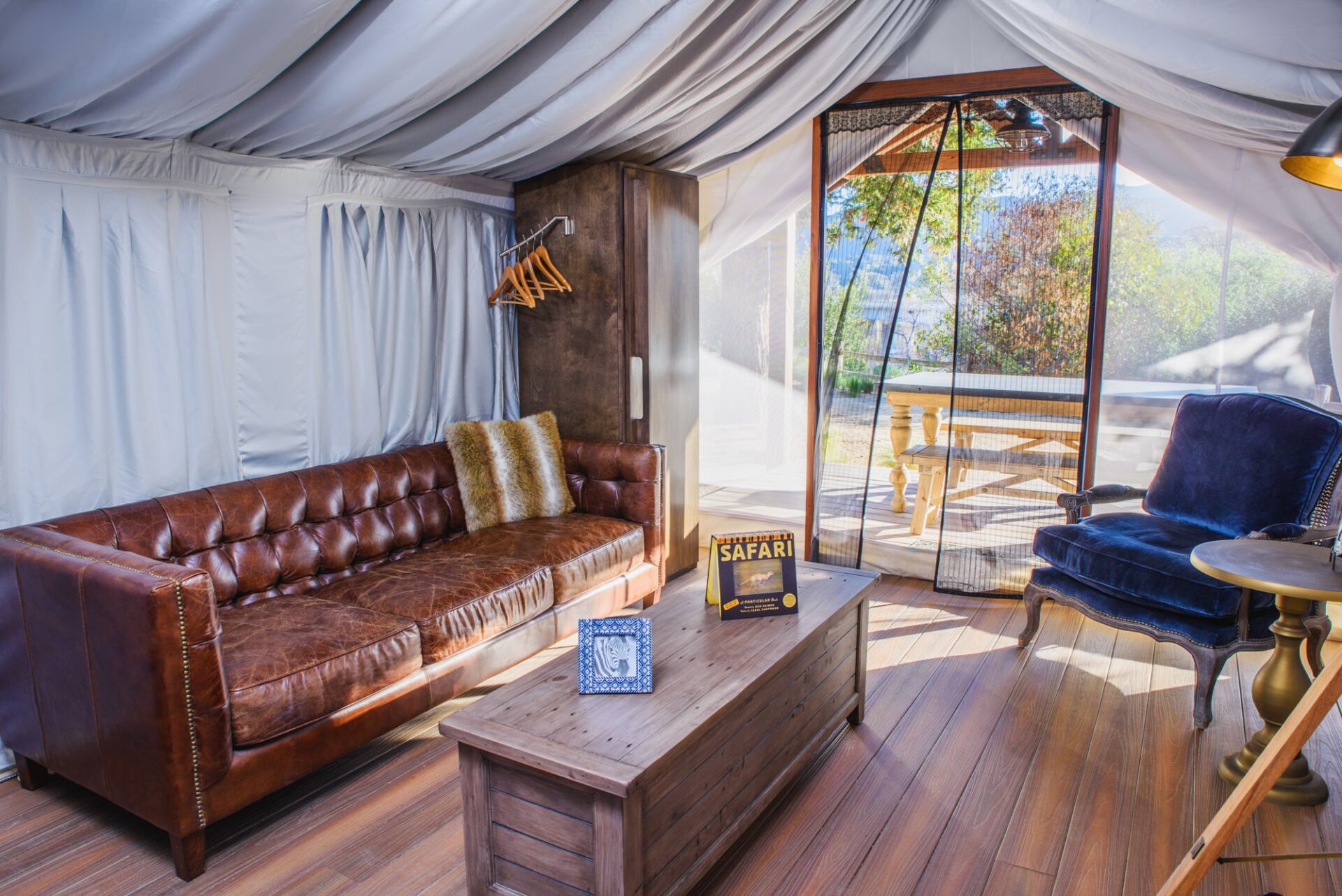 flying-flags-buellton-ca-93427-safari-tent-queens-interior-couch-area-min